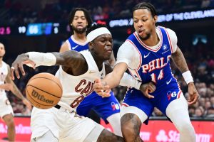 Mar 9, 2026; Cleveland, Ohio, USA; Philadelphia 76ers forward Dalen Terry (14) knocks the ball from Cleveland Cavaliers guard Dennis Schroder (8) during the second half at Rocket Arena.