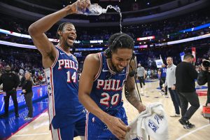 Mar 10, 2026; Philadelphia, Pennsylvania, USA; Philadelphia 76ers guard Cameron Payne (20) has water poured on him by forward Dalen Terry (14) after win against the Memphis Grizzlies at Xfinity Mobile Arena.