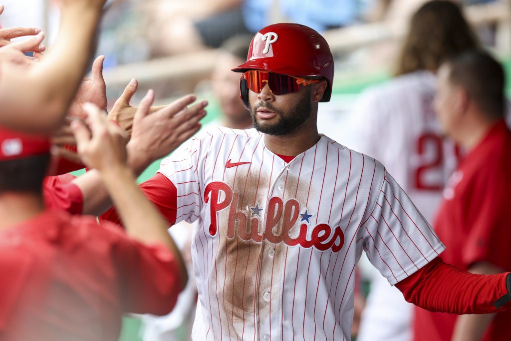 Mar 12, 2026; Clearwater, Florida, USA; Philadelphia Phillies center fielder Justin Crawford (80) reacts after scoring a run against the Toronto Blue Jays in the third inning during spring training at BayCare Ballpark.