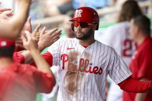 Mar 12, 2026; Clearwater, Florida, USA; Philadelphia Phillies center fielder Justin Crawford (80) reacts after scoring a run against the Toronto Blue Jays in the third inning during spring training at BayCare Ballpark.