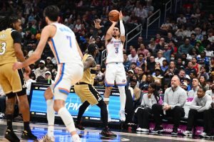 Mar 21, 2026; Washington, District of Columbia, USA; Oklahoma City Thunder guard Jared McCain (3) over Washington Wizards center Alex Sarr (20) during the second half at Capital One Arena.