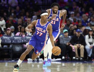 Mar 25, 2026; Philadelphia, Pennsylvania, USA; Philadelphia 76ers guard Vj Edgecombe (77) dribbles up court in front of center Joel Embiid (21) during the second quarter against the Chicago Bulls at Xfinity Mobile Arena.