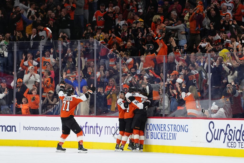 Apr 5, 2026; Philadelphia, Pennsylvania, USA; Philadelphia Flyers right wing Porter Martone (94) celebrates with teammates after scoring a goal against the Boston Bruins in overtime at Xfinity Mobile Arena.