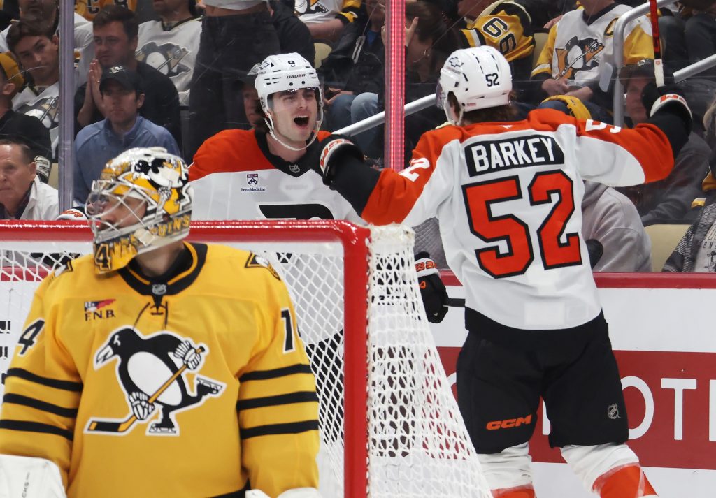 Apr 18, 2026; Pittsburgh, Pennsylvania, USA; Philadelphia Flyers defenseman Jamie Drysdale (9) celebrates his goal with center Denver Barkey (52) against Pittsburgh Penguins goaltender Stuart Skinner (74) during the second period in game one of the first round of the 2026 Stanley Cup Playoffs at PPG Paints Arena.